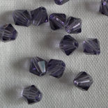 6 CRISTALLI MODELLO BICONO SWAROVSKI 6mm TANZANITE