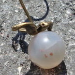 Charm con rondine in bronzo