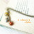 Segnalibro perle arancio campanellino giallo charm cuoricino