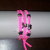 Bracciale in fettuccia di lycra rosa fluo con charms