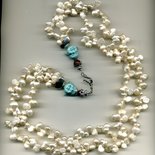 Collana a 2 fili con perle doppie irregolari e testine di Buddha