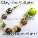 Portaciuccio Baby -UNISEX- verde - cookie, tegolini, abbracci, pan di stelle, dirella, donut
