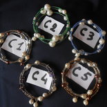 bracciali armonici con perle di vari colori