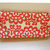 Pochette floreale bianca e rossa