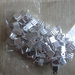 100 terminali fermafili zigrinati metallo color argento 7 mm.