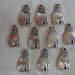 10 Gattini in Metallo color argento 19x10 mm.