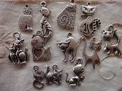 12 Gattini in Metallo color argento di diversi modelli