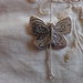 5 Farfalle in Metallo color argento 23x18 mm.