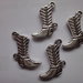 4 Ciondoli Stivali in Metallo color argento 21x20 mm.