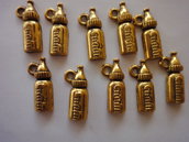 10 Ciondoli Biberon per Neonato in metallo color oro 17x8 mm.