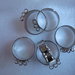 6 basi per anelli regolabili 19x22m. con 6 anellini per ciondoli color argento