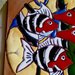 piccolo quadro di ceramica con motivi di pesci e alghe rilevati lucidi su un contorno opaco