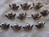 11 Separatori Angelo in metallo color argento 19x13mm.