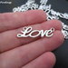 1 Charm/connettore "LOVE" color argento (33x10mm) (cod. new)