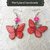 Orecchini farfalle rosse e rosa 