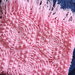 Copertina per carrozzina o culla in morbida lana baby rosa lavorata a mano 
