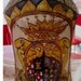 Vaso ad albarello di maiolica anticato con bitume, decorato con smalti in polvere