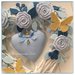 Cuore/fiocco nascita in vimini con roselline,rametti ,cuori azzurri e due farfalle gialle
