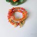 bracciale alta moda arancio con pietre miste e simboli celtici