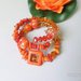 bracciale alta moda arancio con pietre miste e simboli celtici