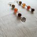 Orecchini pendenti fatti a mano con  pietre dure multicolore e fiore in antico argento tibetano, orecchini in diaspro tonalità 'arancione e charms in argento antico 