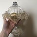 Finale con fiocco, pezzo di ricambio per lampadari di Venini e non, con pezzi rotti o danneggiati, in vetro soffiato, color oro e trasparente 