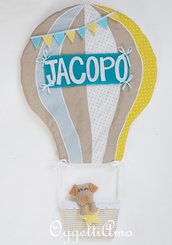Una mongolfiera con cucciolo per annunciare l'arrivo del piccolo di caso: un fiocco nascita originale per decorare la sua cameretta