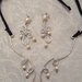 Collana in alluminio battuto con perla centrale in corallo e perle in cotone