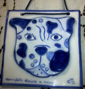  2 e 3 Mattonella di ceramica con testa di cane, ottenute  da un cerchio ritagliato opportunatamente