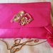 pochette di raso decorata con tecnica soutache