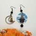 Gattini Renè Magritte orecchini di carta pendenti con perla nera