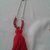 Collana con nappina e pietre rosse