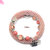 BRACCIALE ARMONICO ROSA A CROCHET DI PERLINE CON CHARM CORONA