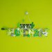 Simpatici procioni per il fiocco nascita del piccolo Lorenzo: una targa grigia e verde per decorare la sua cameretta