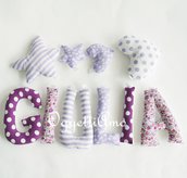 Giulia: una ghirlanda di lettere di stoffa imbottite per decorare la sua cameretta con il suo nome in lilla e viola