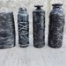Set 4 bottiglie decorate nel cestino nero e argento 