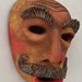 Scultura maschera in terracotta