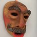 Scultura maschera in terracotta