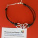 BRACCIALE *ROSY* CON CENTRALE IN ALLUMINIO E CORDONCINO NERO