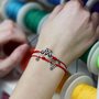 Bracciale di corda con pendente charm in argento Bicicletta, fatto a mano