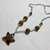 Collana con agate tonde e grossa stella.