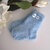 Calzini azzurre neonato fatti a mano idea regalo corredino nascita lana ferri