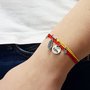 Bracciale di corda con pendente charm in argento Il vento dell'anima, fatto a mano