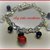 Bracciale con coccinella in fimo e perline