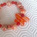 Braccialetto elastico con perle arancioni fatto a mano 