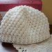 Cappello neonato in lana. Bianco
