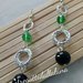 orecchini con perle nere e cristalli verdi pendenti 