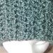Cappello di lana bouclè di color verde perlato caldo e morbido realizzato a uncinetto a mezza maglia alta 