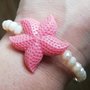 Bracciale stella marina e mezzi cristalli bianchi con sfumature rosa