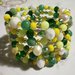 Bracciale bangle con cristalli e perline tra il giallo e il verde